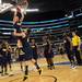 The Michigan basketball team watches as freshman Spike Albrecht, with a little help from freshman Mitch McGary dunks the ball at the end of practice at Cowboys Stadium in Arlington, Texas on Thursday, March 28, 2013. Melanie Maxwell I AnnArbor.com